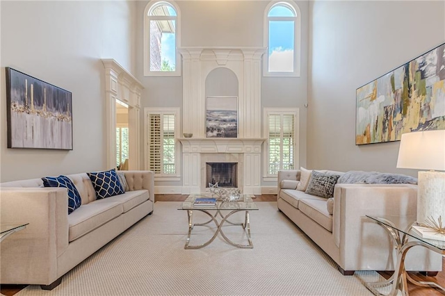 living room featuring a towering ceiling