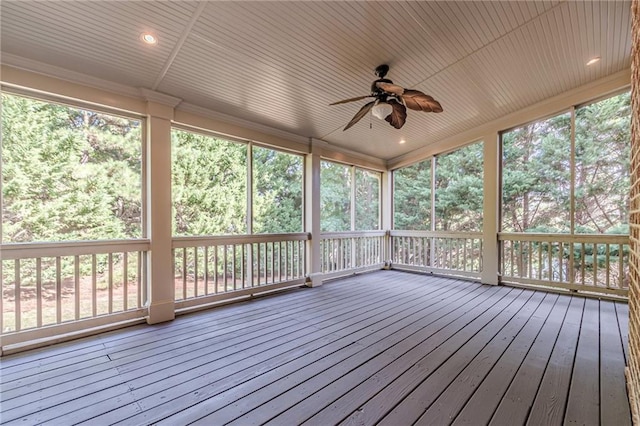 unfurnished sunroom with plenty of natural light and ceiling fan