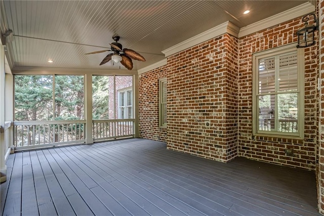 unfurnished sunroom featuring ceiling fan