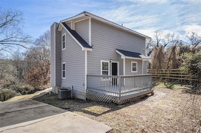 back of house featuring a deck and central AC unit