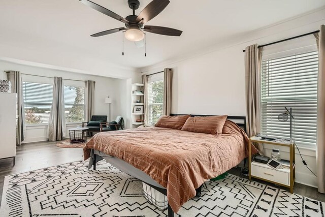 bedroom featuring a ceiling fan and light wood-style floors