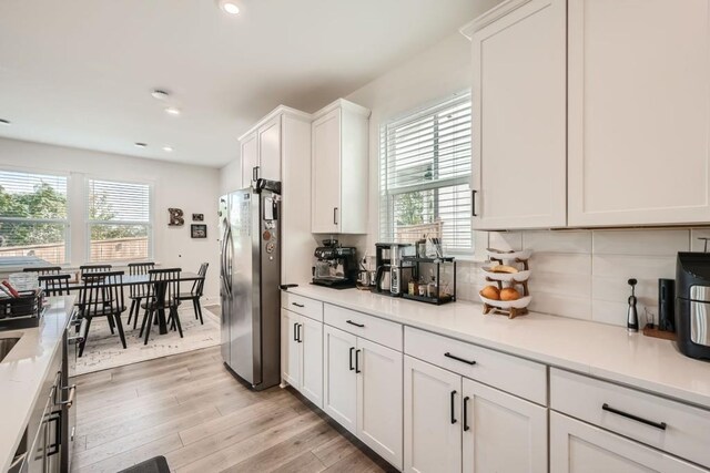 dining room featuring recessed lighting, baseboards, and wood finished floors