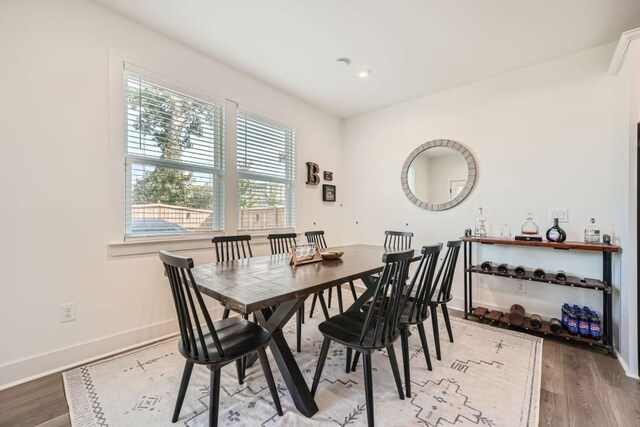 living area featuring a ceiling fan, a tiled fireplace, wood finished floors, recessed lighting, and baseboards