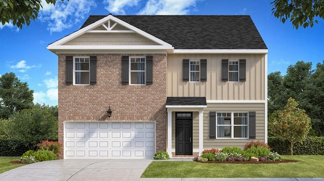 view of front of property with a front yard and a garage