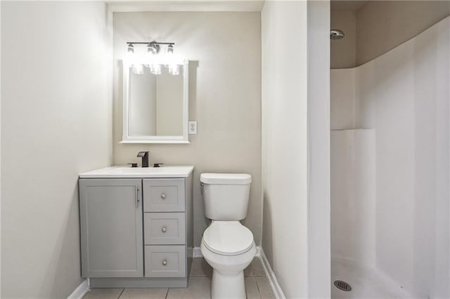 bathroom featuring walk in shower, tile patterned floors, vanity, and toilet