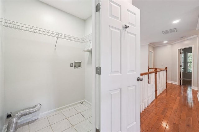 laundry area with recessed lighting, light wood finished floors, visible vents, baseboards, and washer hookup