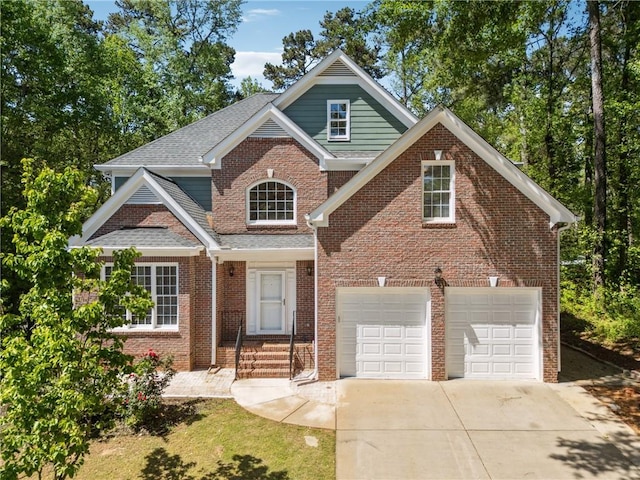 craftsman inspired home with concrete driveway, brick siding, and roof with shingles