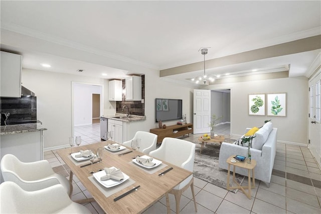 dining room with baseboards, a chandelier, light tile patterned floors, and crown molding