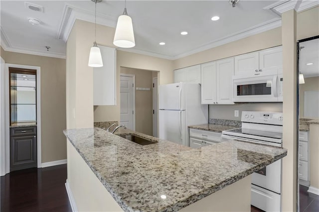 kitchen with dark hardwood / wood-style flooring, white appliances, pendant lighting, white cabinetry, and kitchen peninsula