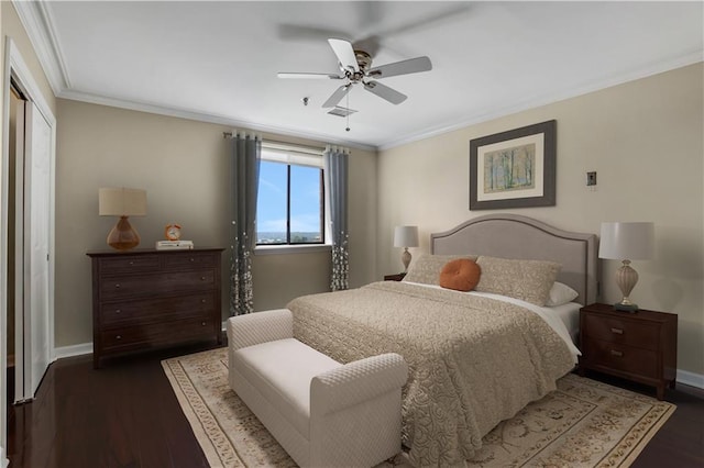 bedroom with ceiling fan, dark hardwood / wood-style flooring, and ornamental molding