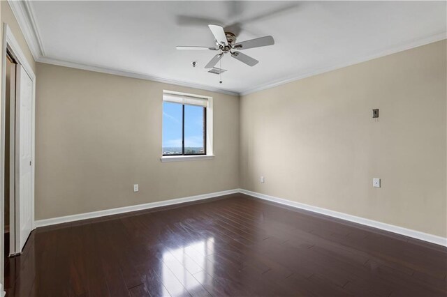 spare room with ceiling fan, ornamental molding, and hardwood / wood-style floors