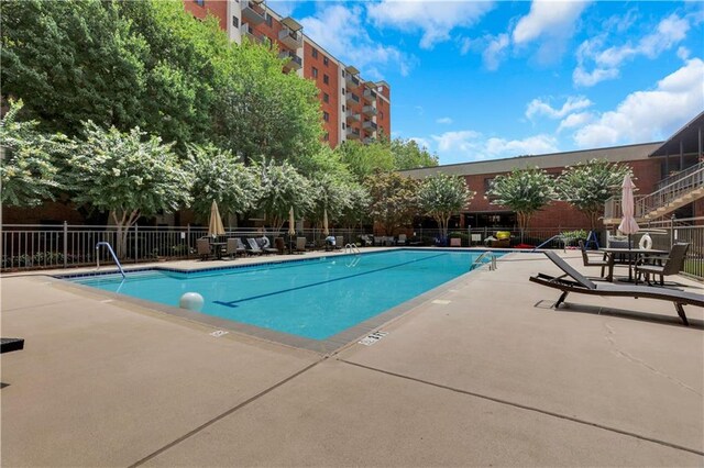 view of pool featuring a patio