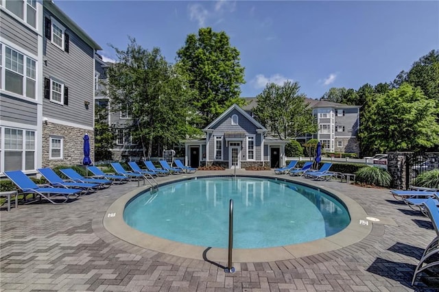 view of swimming pool with a patio area