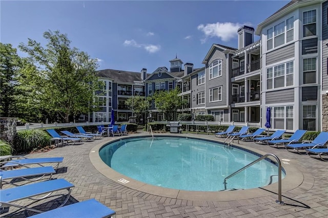 view of swimming pool with a patio area