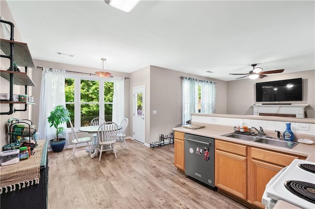 kitchen with stainless steel dishwasher, a sink, white range with electric cooktop, light wood-style floors, and light countertops
