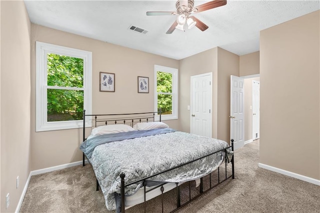 bedroom featuring carpet flooring, baseboards, and ceiling fan