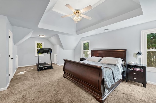 bedroom featuring light carpet and multiple windows