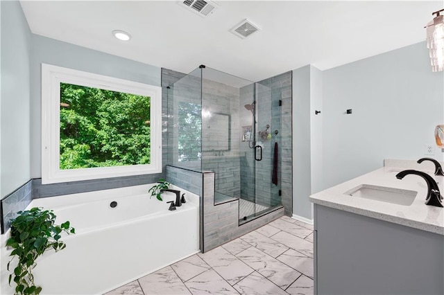 full bath featuring marble finish flooring, a bath, a shower stall, recessed lighting, and double vanity