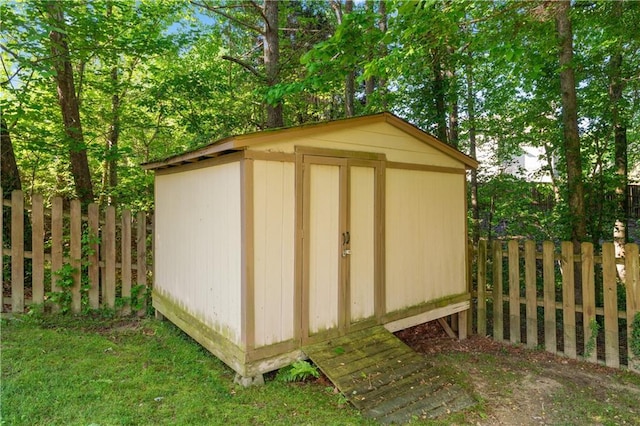 view of shed with a fenced backyard