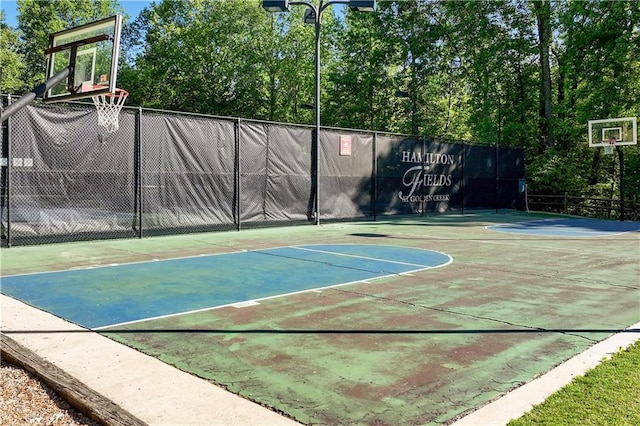 view of sport court with community basketball court and fence