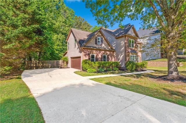 traditional-style home featuring driveway and a garage