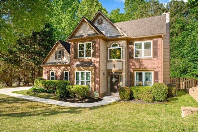 view of front of house with a chimney and brick siding