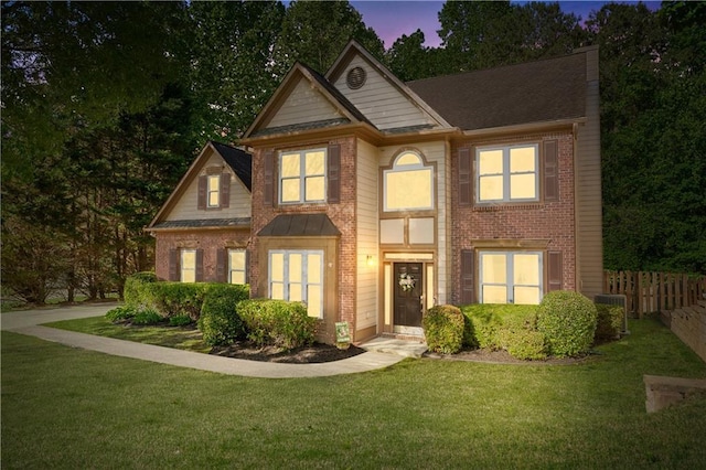 traditional-style home with brick siding