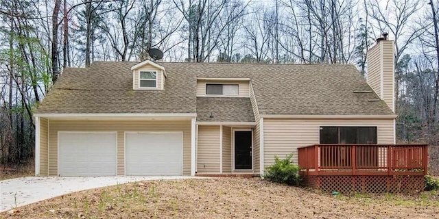 view of front of property with a garage and a deck