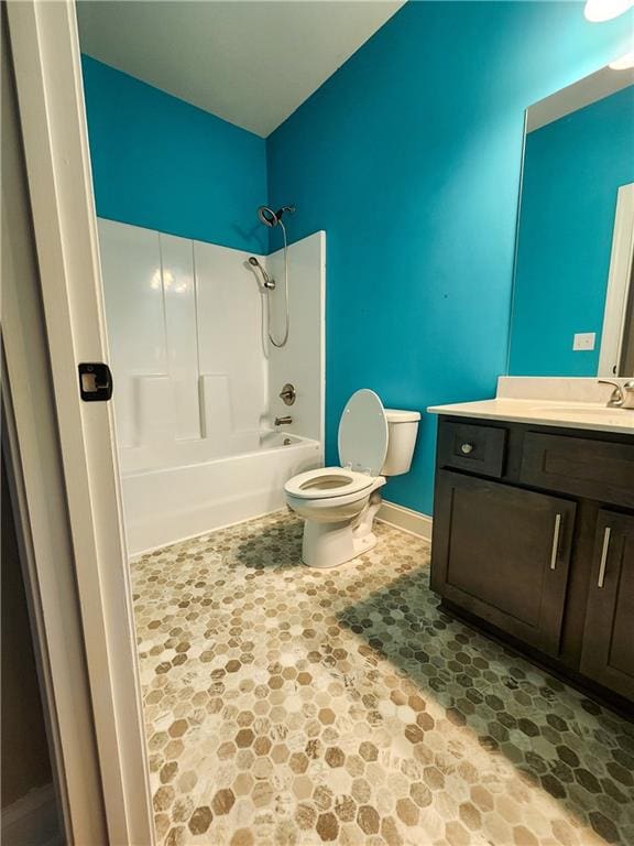 full bathroom with vanity, toilet, and  shower combination