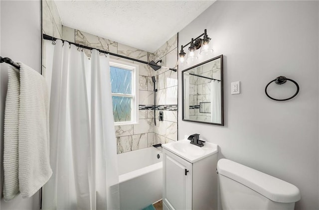 full bathroom featuring vanity, toilet, shower / bath combo, and a textured ceiling