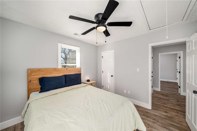 bedroom featuring hardwood / wood-style floors and ceiling fan