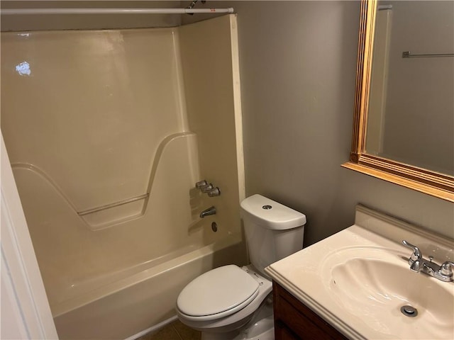 bathroom featuring toilet, shower / bathtub combination, and vanity