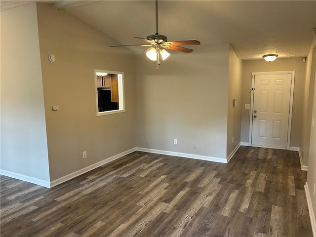 unfurnished room with dark wood-style floors, lofted ceiling, baseboards, and a ceiling fan