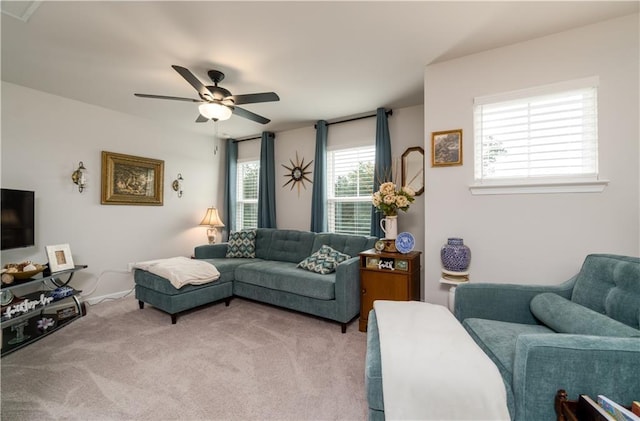 living room featuring light colored carpet and ceiling fan