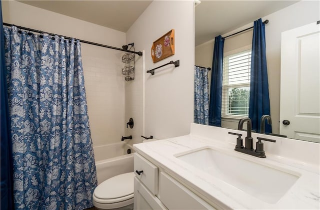 bathroom with vanity, toilet, and shower / tub combo with curtain