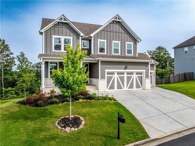 craftsman inspired home with board and batten siding, driveway, a garage, and a shingled roof
