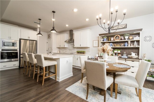 17 Ridgeline Way NW, Cartersville, GA 30121 - dining space featuring a chandelier, recessed lighting, and dark wood-type flooring