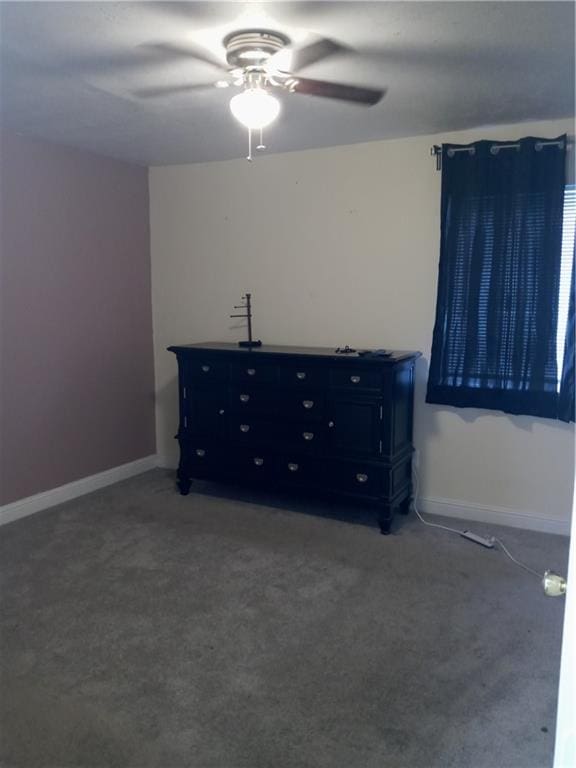 unfurnished bedroom featuring carpet and ceiling fan