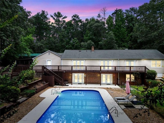 280 W Knight Rd W, Mcdonough, GA 30252 - rear view of property with french doors, a wooden deck, stairs, and a patio area