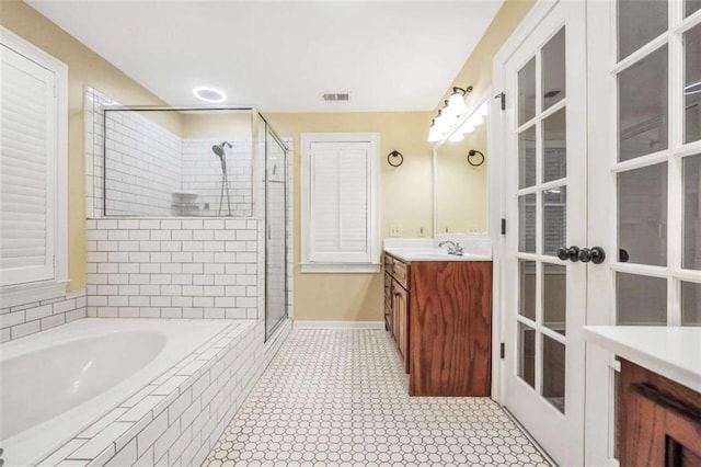 280 W Knight Rd W, Mcdonough, GA 30252 - bathroom with vanity, a stall shower, a garden tub, tile patterned flooring, and french doors