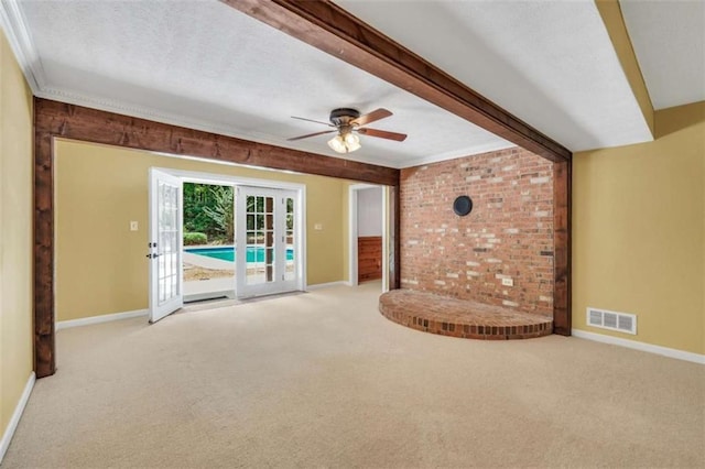 280 W Knight Rd W, Mcdonough, GA 30252 - unfurnished living room with carpet floors, a ceiling fan, crown molding, beamed ceiling, and a textured ceiling
