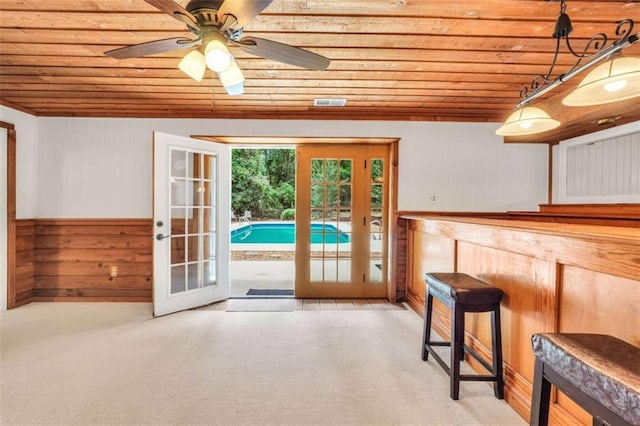 280 W Knight Rd W, Mcdonough, GA 30252 - doorway with wooden ceiling, french doors, light colored carpet, wooden walls, and a ceiling fan