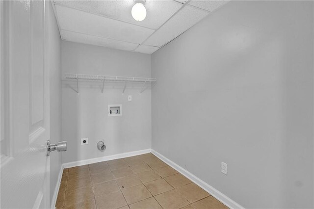 2551 Tolliver Dr, Ellenwood, GA 30294 - clothes washing area featuring washer hookup, light tile patterned flooring, baseboards, hookup for an electric dryer, and laundry area