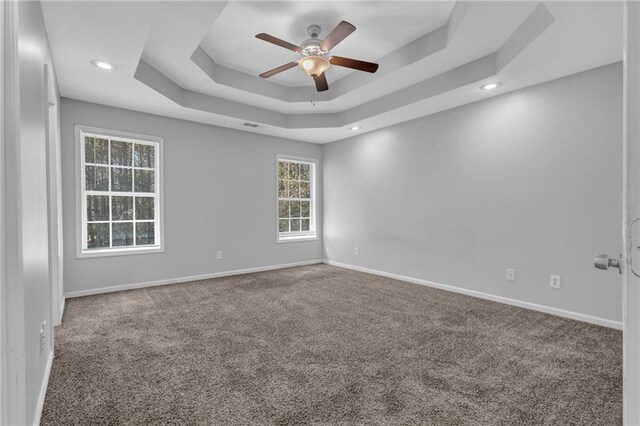 2551 Tolliver Dr, Ellenwood, GA 30294 - empty room with a ceiling fan, baseboards, recessed lighting, a raised ceiling, and carpet flooring