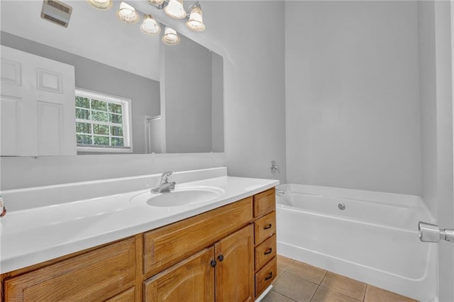 2551 Tolliver Dr, Ellenwood, GA 30294 - full bathroom featuring vanity, tile patterned floors, a bath, and visible vents