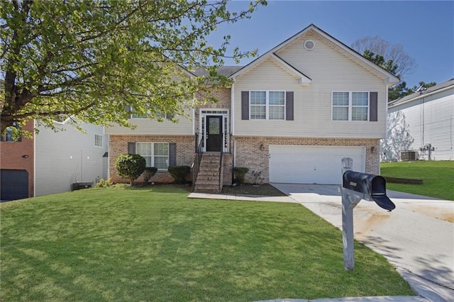 2551 Tolliver Dr, Ellenwood, GA 30294 - split foyer home featuring brick siding, driveway, a front lawn, and a garage