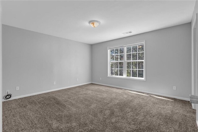 2551 Tolliver Dr, Ellenwood, GA 30294 - empty room featuring visible vents, baseboards, and carpet
