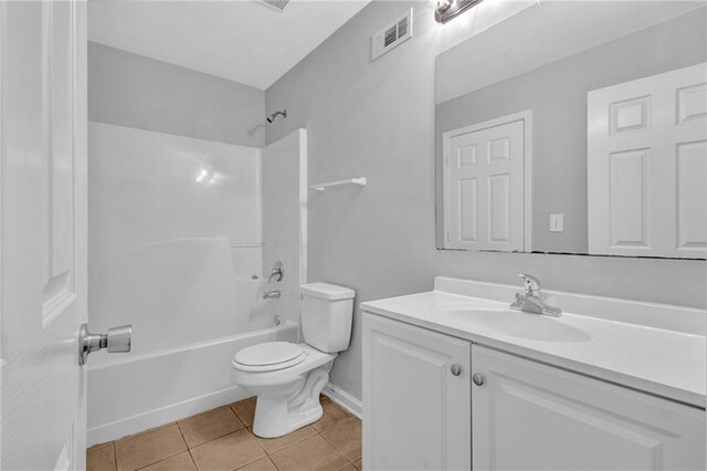 2551 Tolliver Dr, Ellenwood, GA 30294 - bathroom featuring vanity, washtub / shower combination, visible vents, tile patterned flooring, and toilet