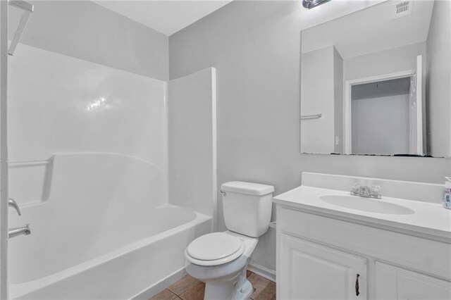 2551 Tolliver Dr, Ellenwood, GA 30294 - bathroom with visible vents, tub / shower combination, toilet, tile patterned floors, and vanity