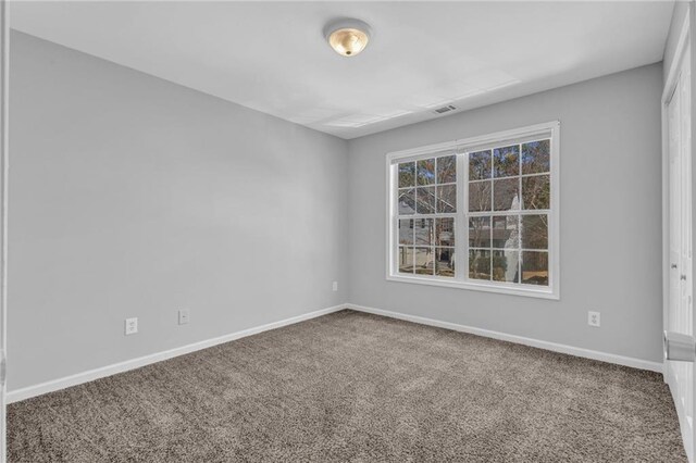2551 Tolliver Dr, Ellenwood, GA 30294 - carpeted empty room featuring visible vents and baseboards